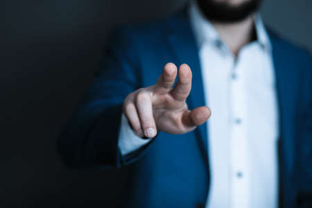 man finger touching in screenの写真素材
