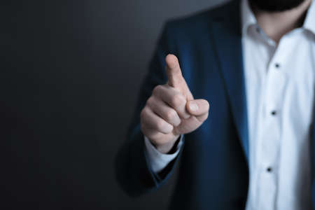 man finger touching in screenの写真素材