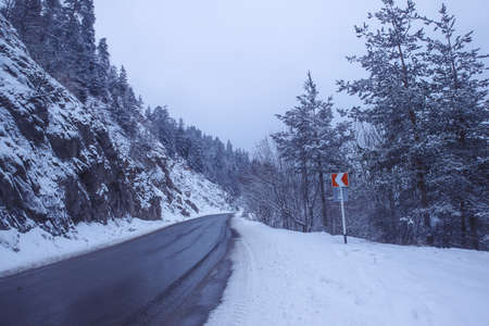 Beautiful snowy road in winter landscapeの写真素材