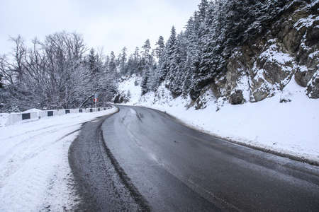 Beautiful snowy road in winter landscapeの写真素材