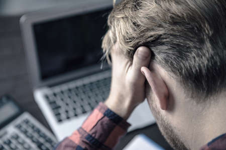 sad man in working desk