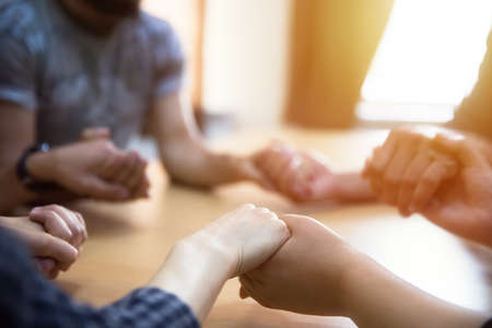 team people hands on wooden deskの写真素材