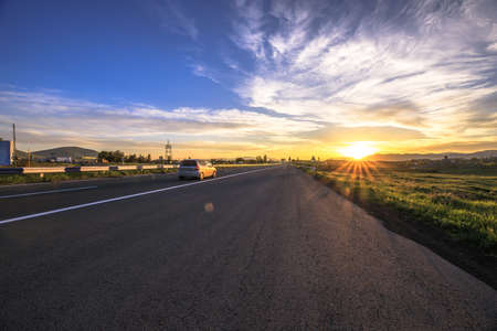 corolful sunset with asphlt roadの写真素材