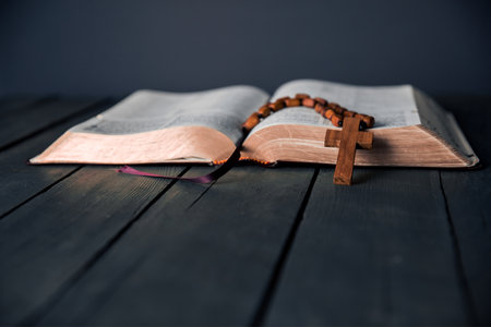 wooden cross on the open Bibleの写真素材
