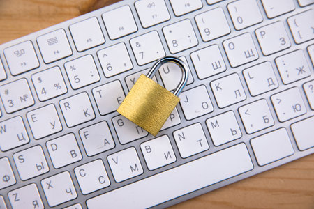 lock on the white computer keyboard on desk