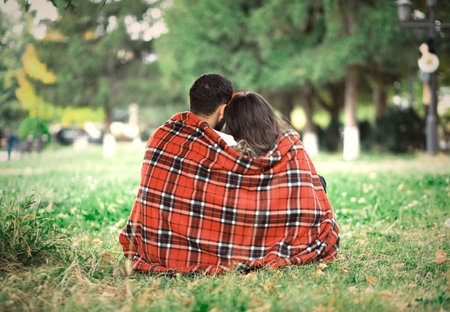 lovely woman and man sitting in gardenの写真素材