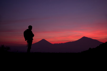 traveler man with ararat mountain at sunset