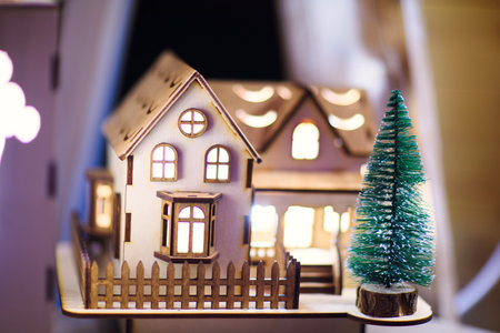 wooden house with christmas tree toyの写真素材