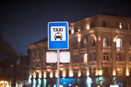 taxi signs on the road at the nightの写真素材