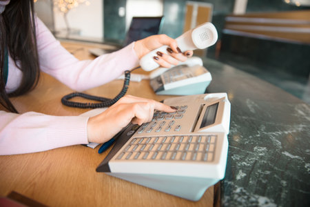 Secretary hand phones in halls background