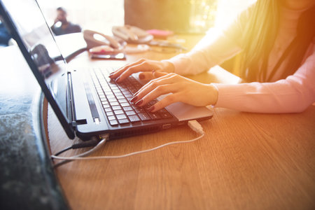 woman working in computer on the deskの写真素材