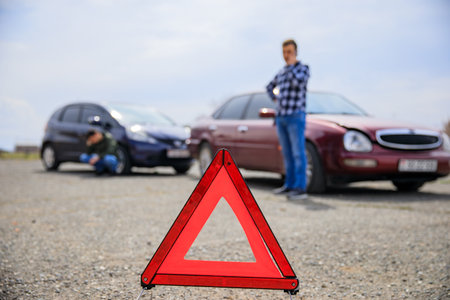 Man calling and car crash on the road