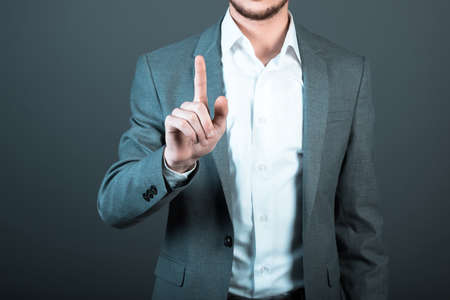 young businessman touching in screenの写真素材