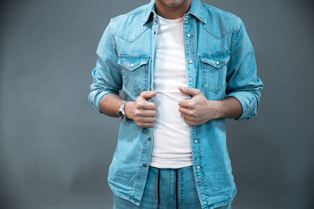 young fashion man on gray backgroundの写真素材