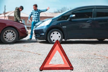angry man and car accident in streetの写真素材