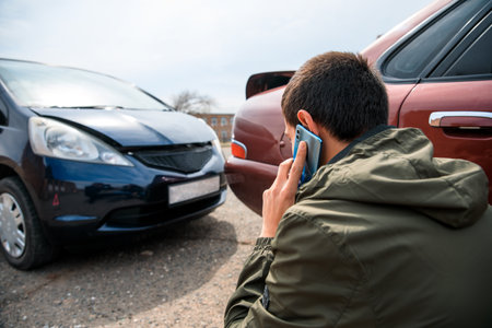 talking man with car accident in street backgroundの写真素材