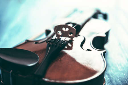 violin on the black wooden tableの写真素材
