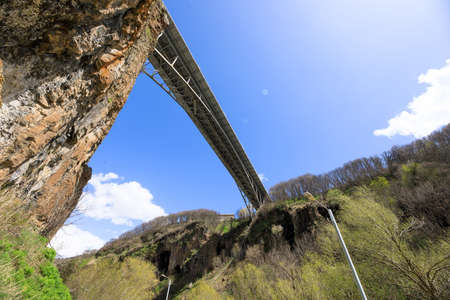 High bridge over the canyon under skyの写真素材