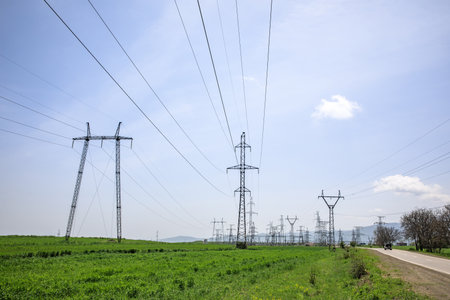 electrical tower at the cloudy sky background
