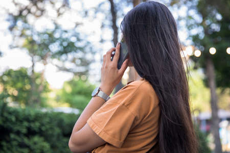 woman talking in phone in the streetの写真素材