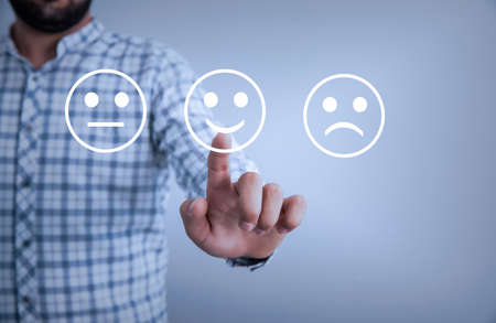 man touching in smile in screen backgroundの写真素材