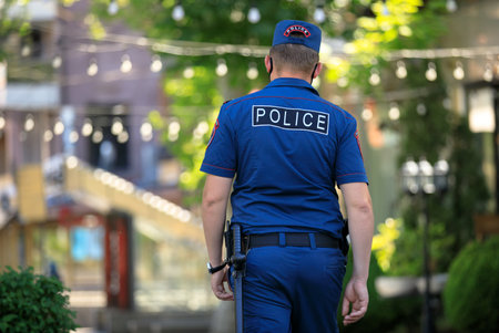 the young policeman in the street background