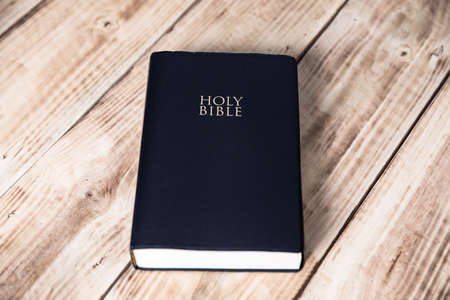 Holy Bible on the wooden table background