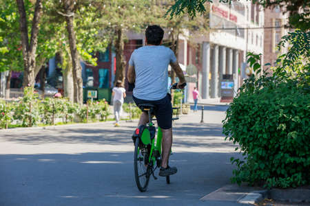 Young man with the bicycle in the parkの写真素材