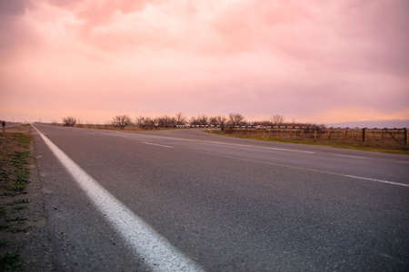 asphalt road at the sunset backgroundの写真素材