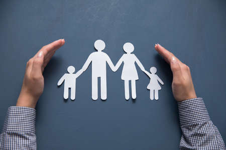 woman hands paper of family sign on tableの写真素材