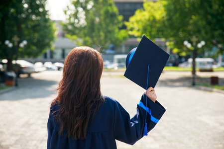 woman hand graduate hat in the natureの写真素材