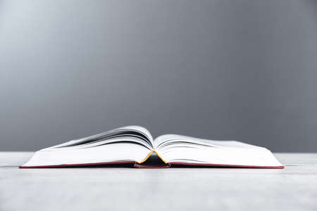 Open bible on the table. On wooden backgroundの写真素材