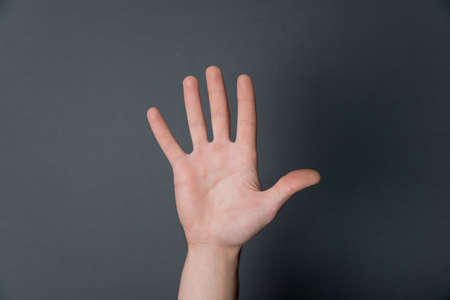man hand on a black backgroundの写真素材
