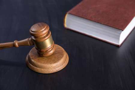 judge and book on the tableの写真素材