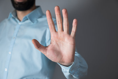 young business man hand stop signの写真素材