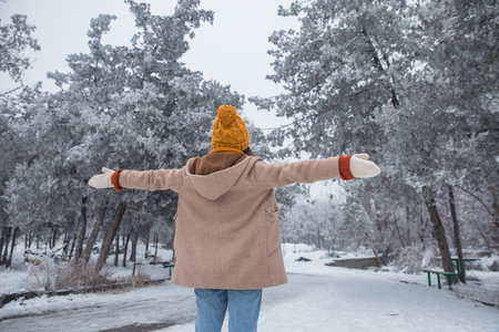 happy woman in snowy park background