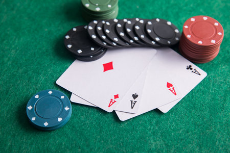 Pair of aces with poker chips on the poker tableの写真素材