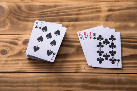 Playing cards on the wooden tableの写真素材