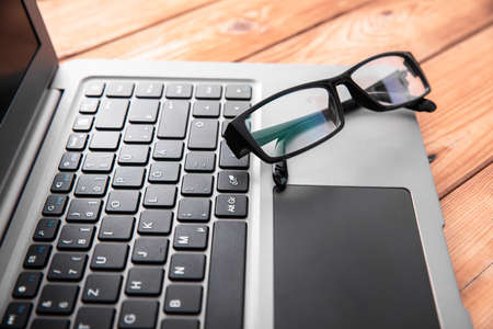 glasses on the computer laptop on desk