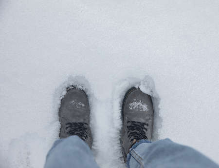 woman feet in snow in winterの写真素材