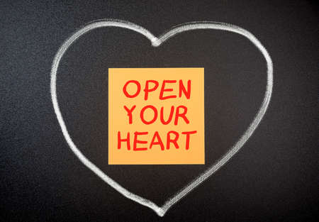 Open your heart with drawn heart on chalkboardの写真素材