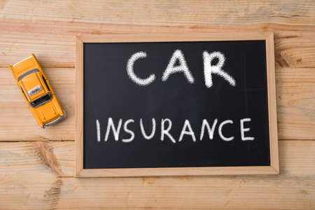 car insurance on board with car modelの写真素材