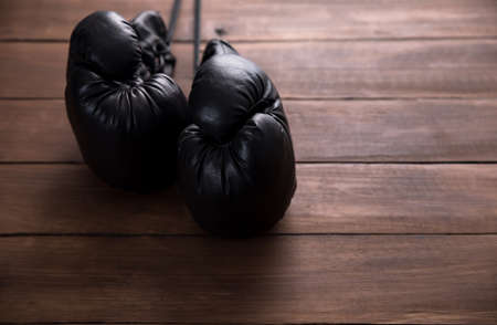 gloves for boxing on the wooden tableの写真素材