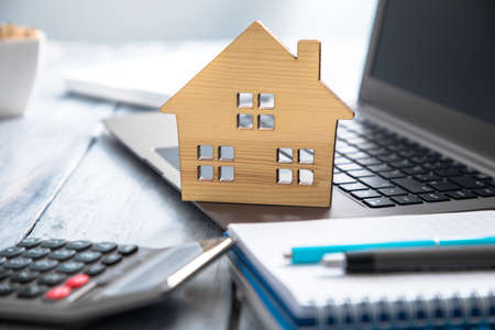 house model with notepad on keyboardの写真素材