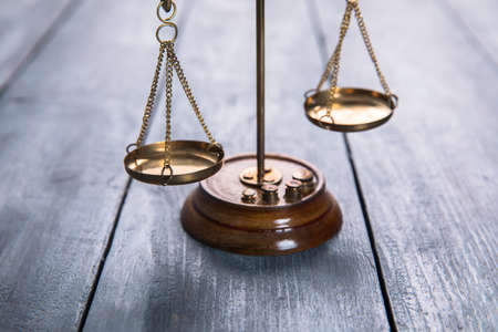 Law scales on table background. Symbol of justiceの写真素材