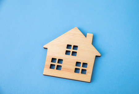 wooden house model on the blue backgroundの写真素材