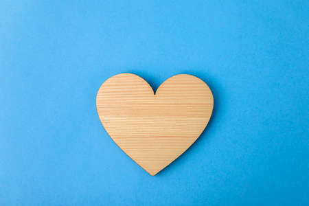 wooden heart on the blue backgroundの写真素材
