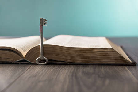 key with book on the wooden table
