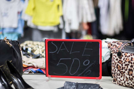 Sale 50% on board in shop background