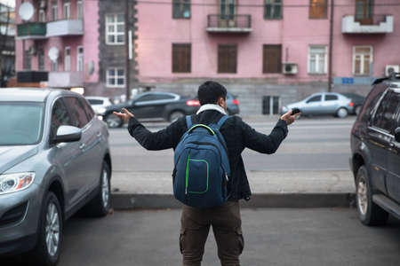 sad man with stolen car in the parking lotの写真素材